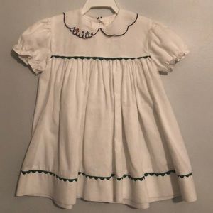 White sailboat dress with green trim